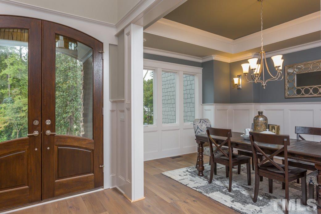 3208 Cobblestone Court Raleigh, NC 27607 - Photo 14 of 25 a view of a dining room with furniture and windows