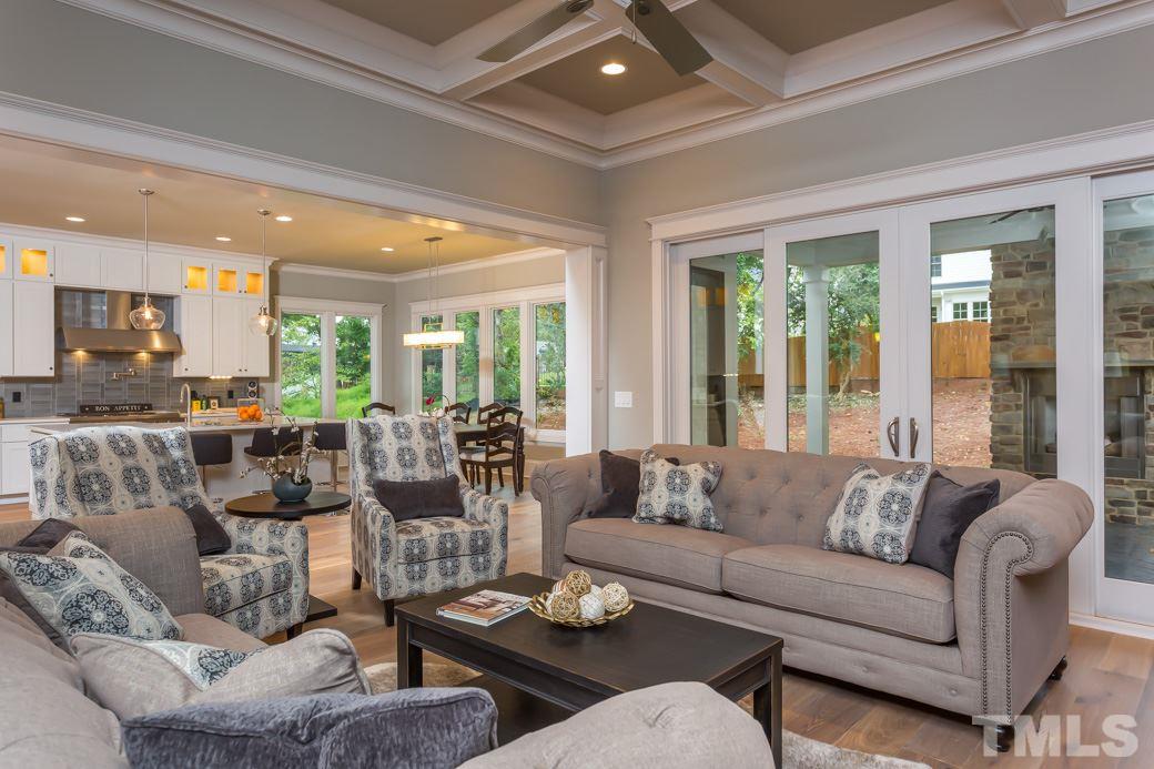 3208 Cobblestone Court Raleigh, NC 27607 - Photo 3 of 25 a living room with furniture and a large window