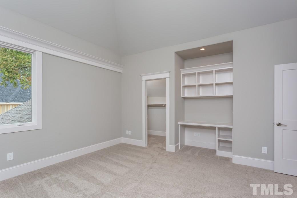 3208 Cobblestone Court Raleigh, NC 27607 - Photo 22 of 25 a view of an empty room with a closet and a window