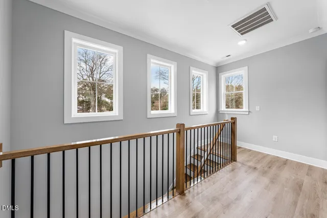 a view of a hallway with windows