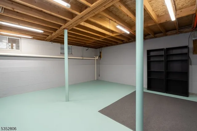 a view of an empty room with a white walls