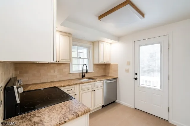 a kitchen with a sink and cabinets
