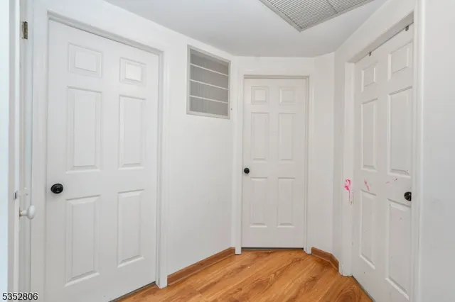 a view of a livingroom with wooden floor