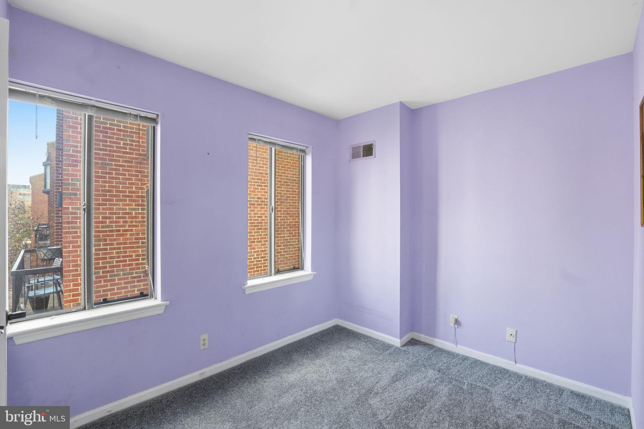 1066 Paper Mill Court, Unit 1066 Washington, DC 20007 - Photo 13 of 25 an empty room with windows