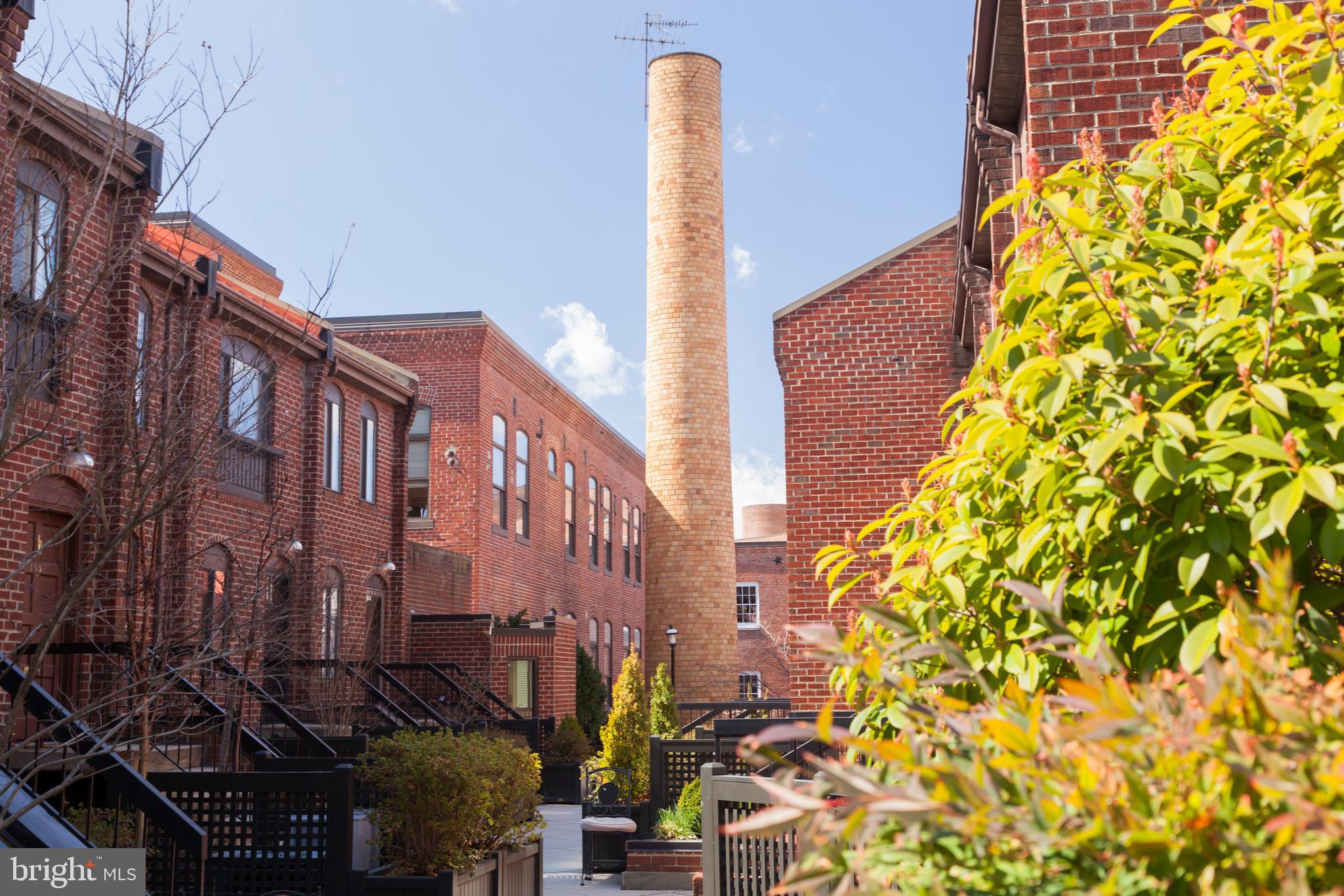 1066 Paper Mill Court, Unit 1066 Washington, DC 20007 - Photo 17 of 25 a street view and tall buildings
