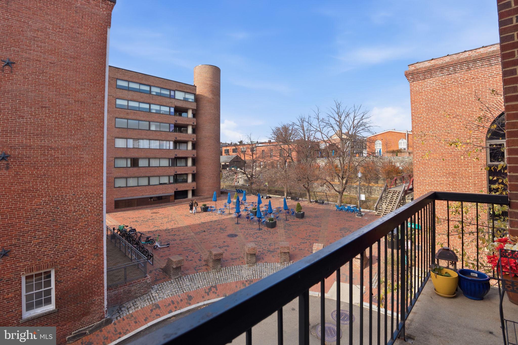 1066 Paper Mill Court, Unit 1066 Washington, DC 20007 - Photo 7 of 25 a view of swimming pool from a balcony