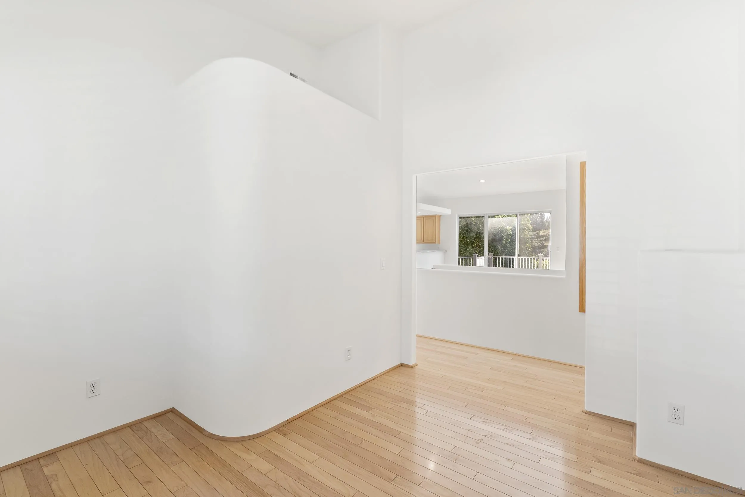 28328 Kettering Lane Escondido, CA 92026 - Photo 17 of 50 a view of an empty room with wooden floor and a window