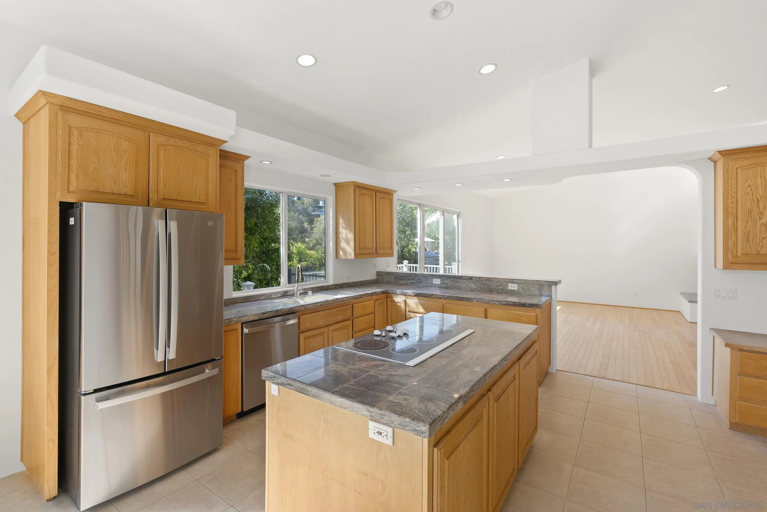 28328 Kettering Lane Escondido, CA 92026 - Photo 5 of 47 a kitchen with stainless steel appliances granite countertop a refrigerator a sink and a refrigerator
