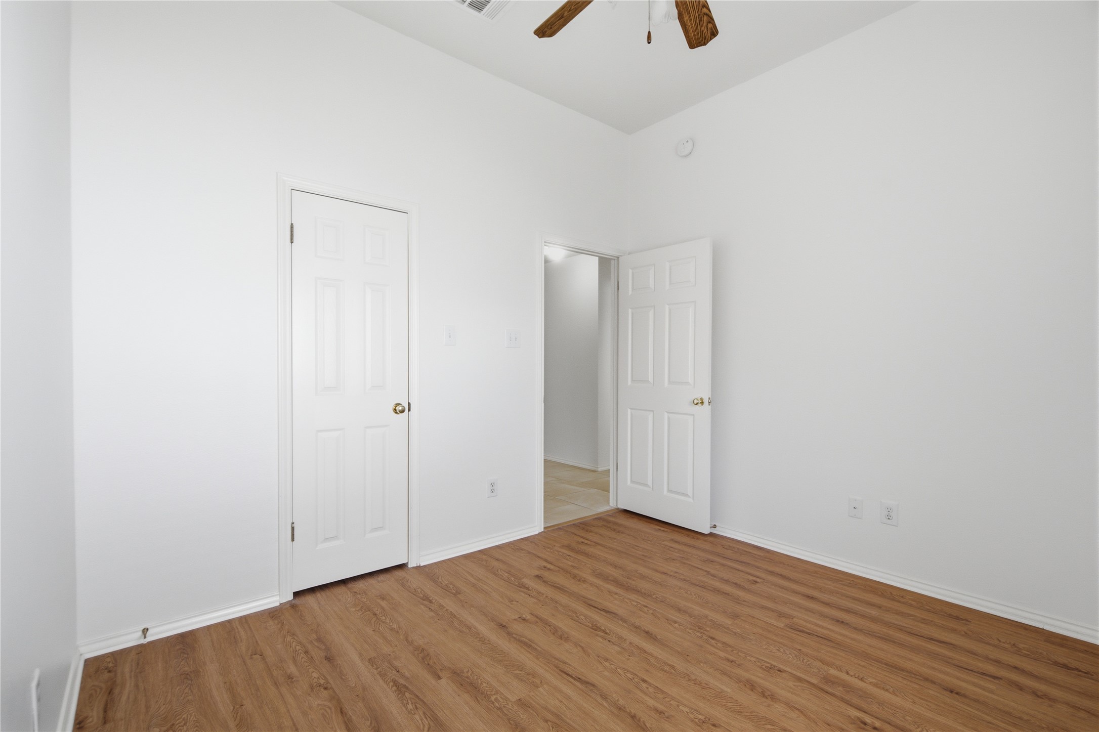 2920 Warwick Way Austin, TX 78748 - Photo 24 of 36 Secondary bedroom #2 features vaulted ceilings and rich wood-like flooring