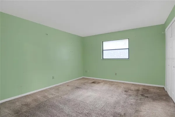 a view of a room that has a window in it