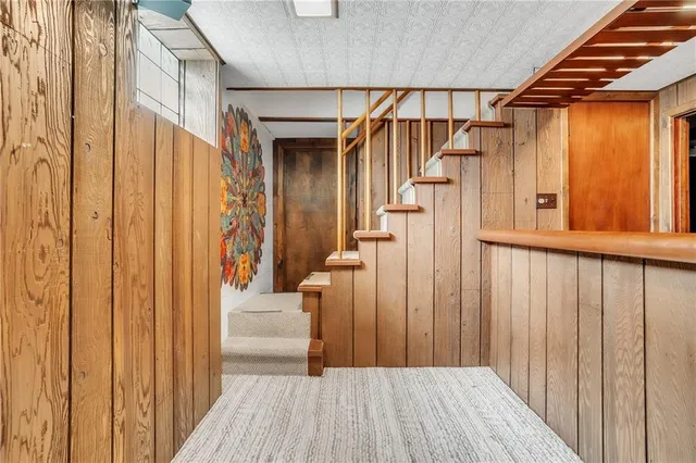 a view of a kitchen with wooden floor and a kitchen
