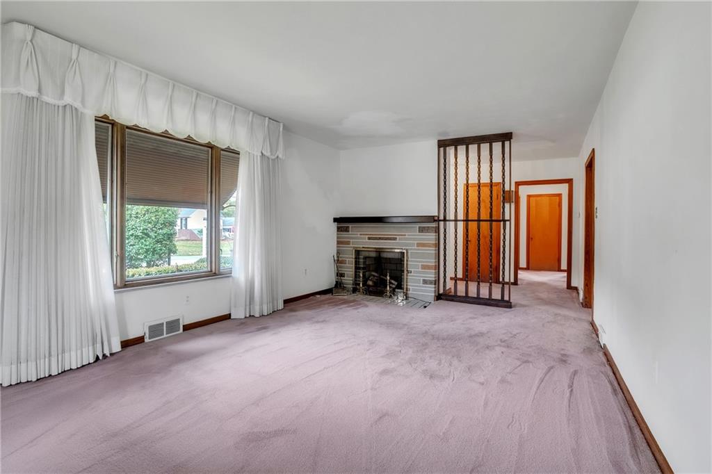 710 Walnut Street Monongahela, PA 15063 - Photo 3 of 46 an empty room with windows and fireplace
