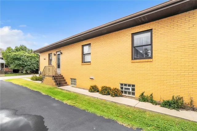 a view of a brick house with wooden floor