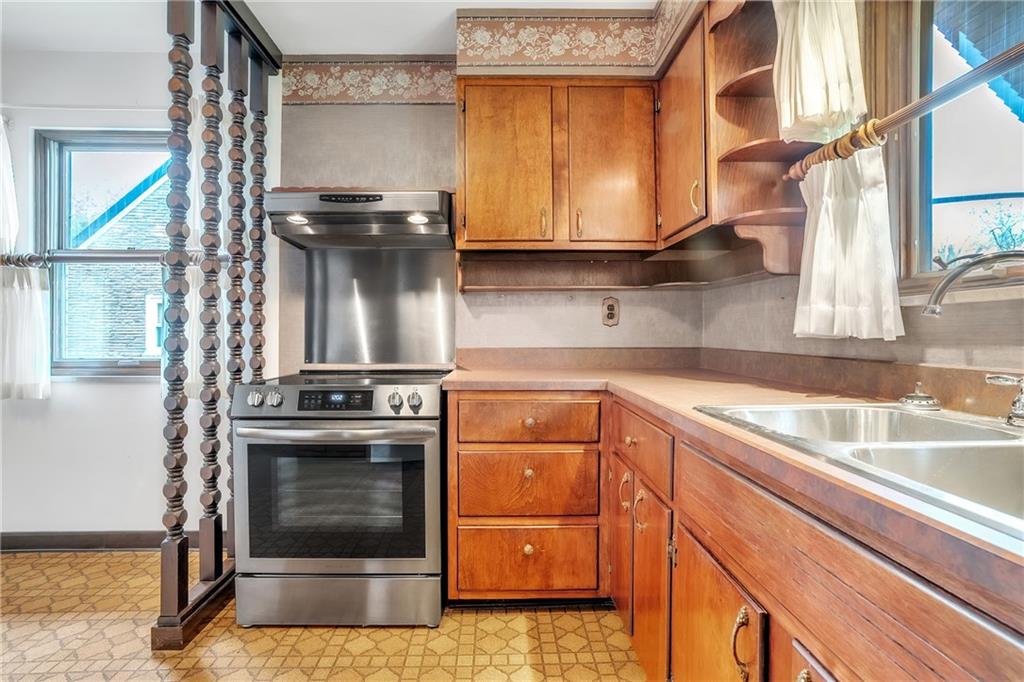 710 Walnut Street Monongahela, PA 15063 - Photo 8 of 46 a kitchen with a stove and a sink