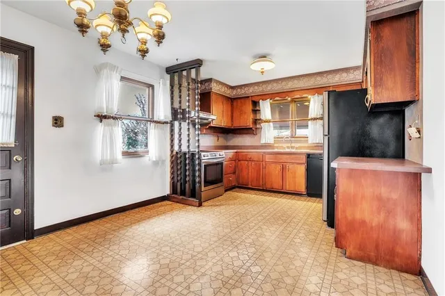 a view of a kitchen with microwave and cabinets