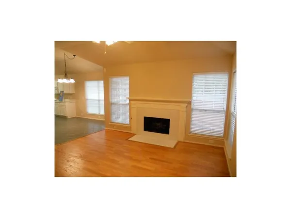 a view of a living room with a large kitchen