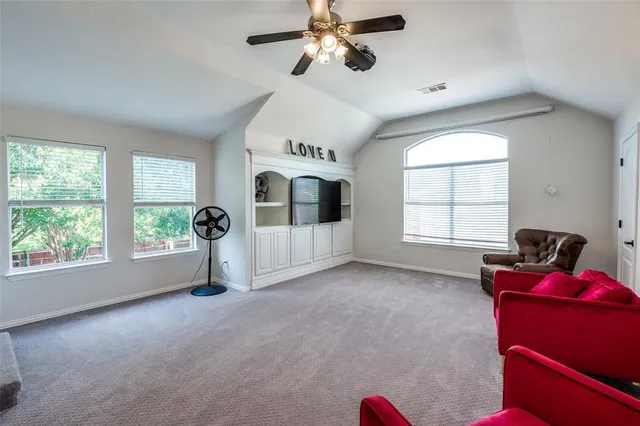 a view of livingroom with furniture window and ceiling fan