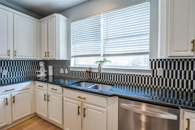 a kitchen with a sink and a window