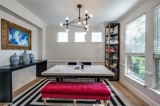 a room with furniture pool table and windows