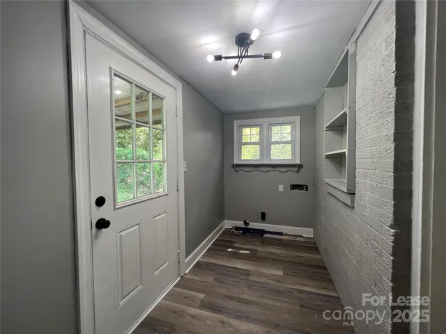 a view of a hallway with windows