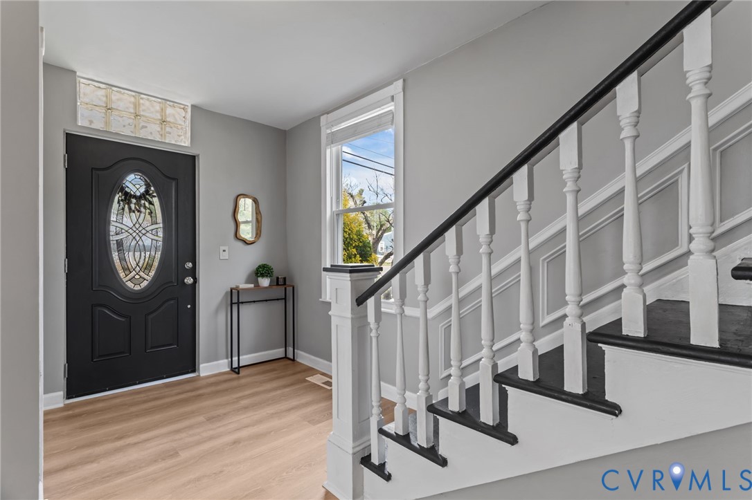 Entryway with stairway, LVP floors and coat closet
