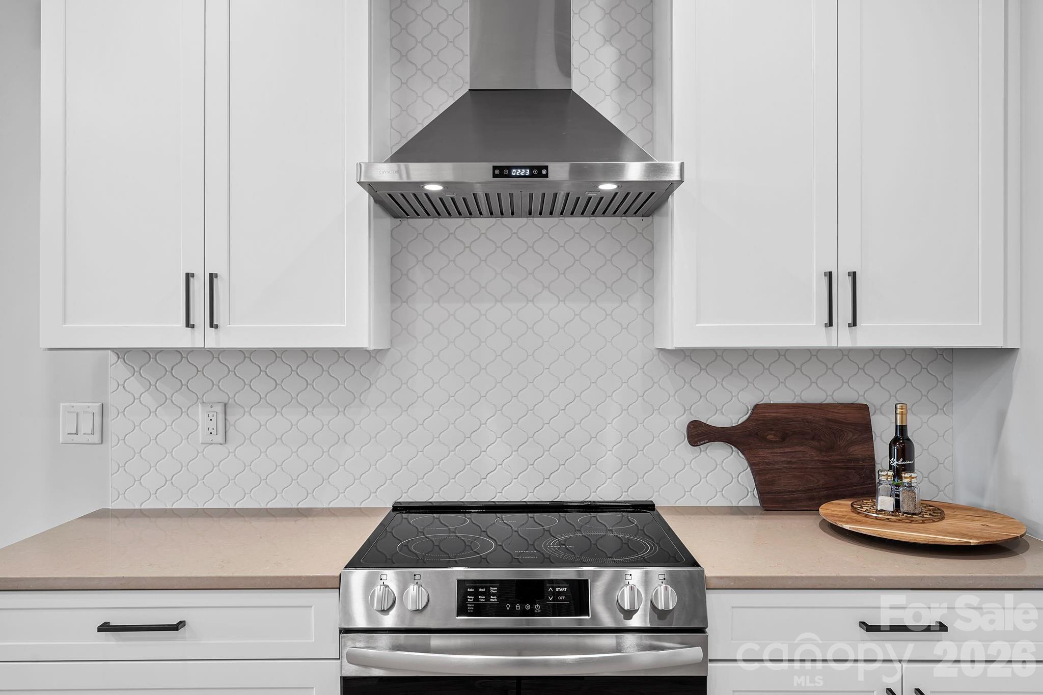 5 Gudger Road Asheville, NC 28715 - Photo 12 of 47 a stove top oven sitting inside of a kitchen