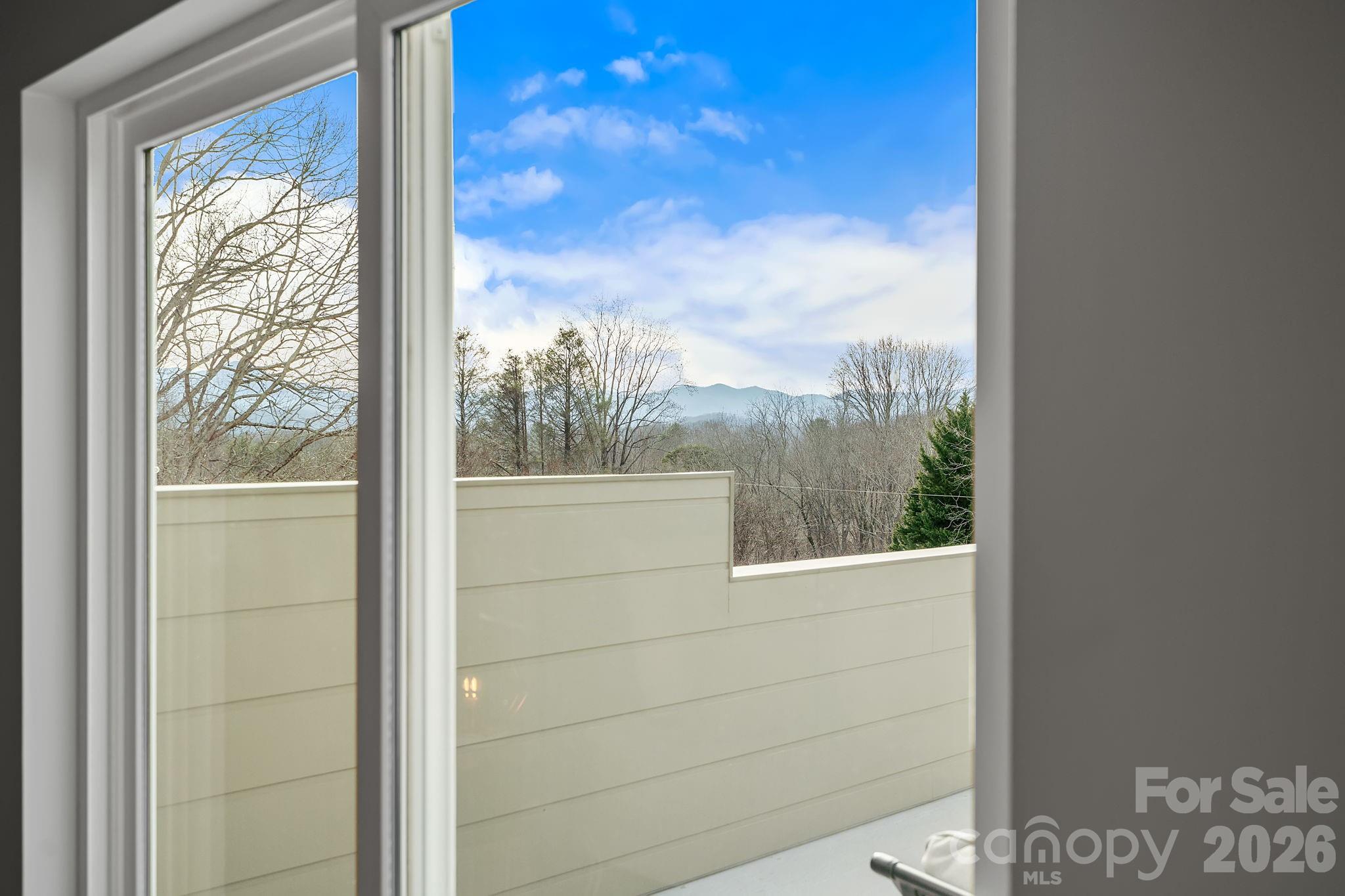 5 Gudger Road Asheville, NC 28715 - Photo 23 of 47 a view of a glass door and a window