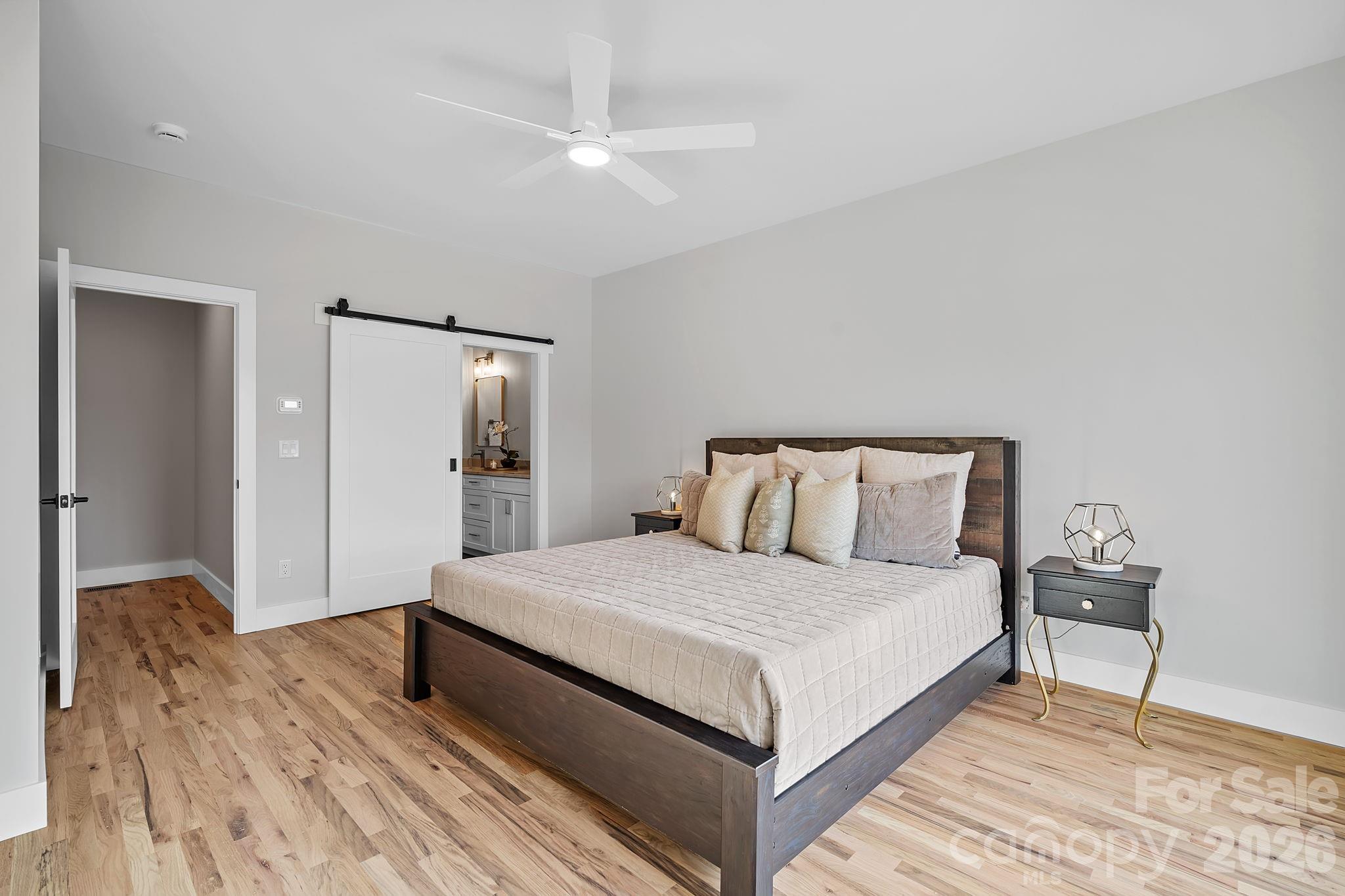 5 Gudger Road Asheville, NC 28715 - Photo 26 of 47 a bedroom with a bed and a table