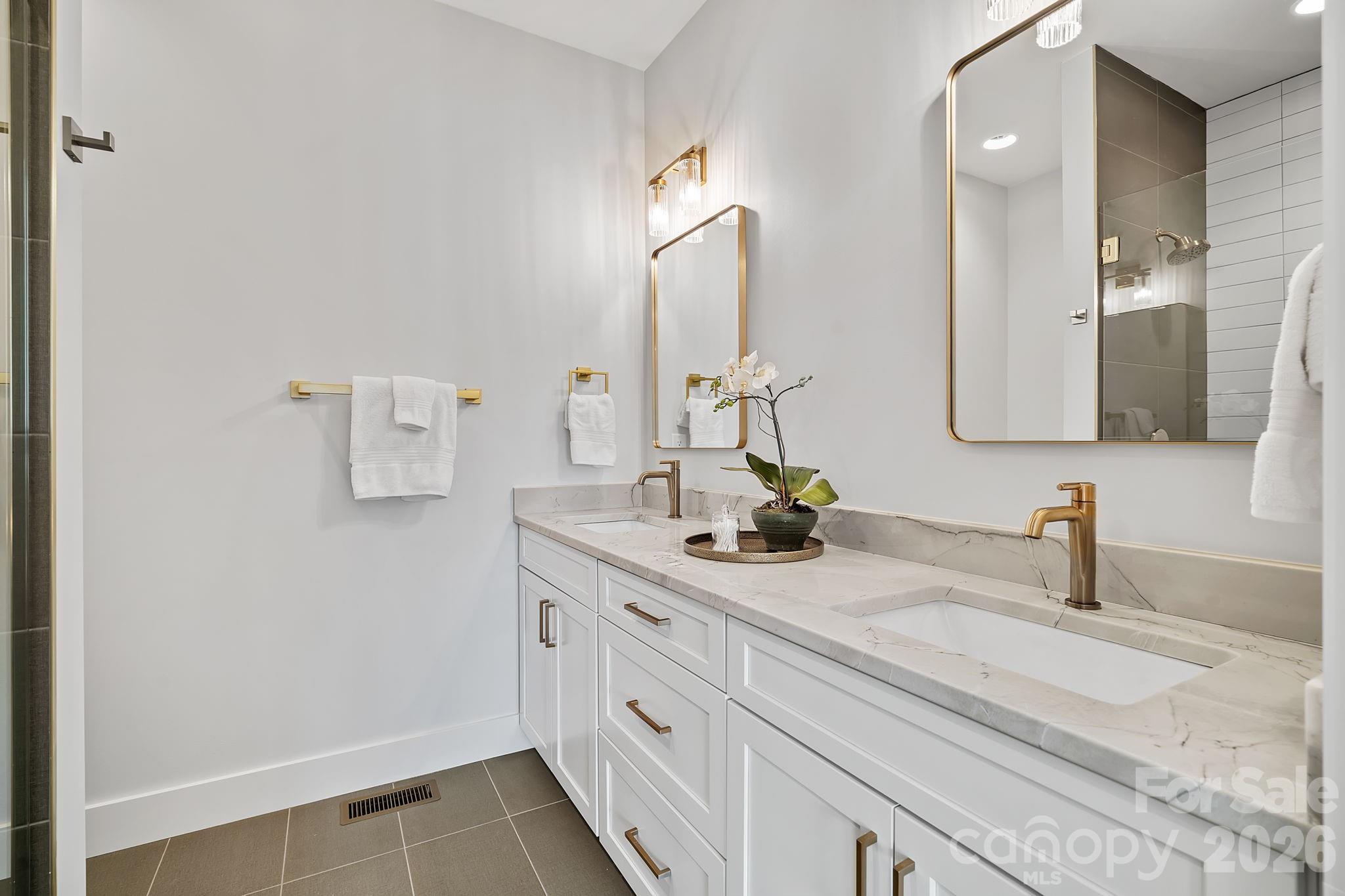 5 Gudger Road Asheville, NC 28715 - Photo 28 of 47 a bathroom with a sink and a mirror