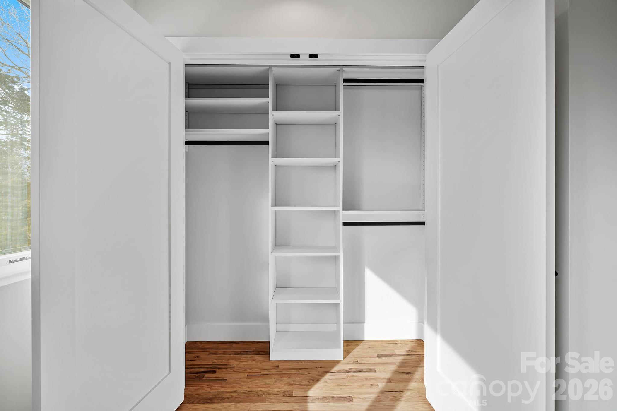 5 Gudger Road Asheville, NC 28715 - Photo 37 of 47 a view of walk in closet with empty racks
