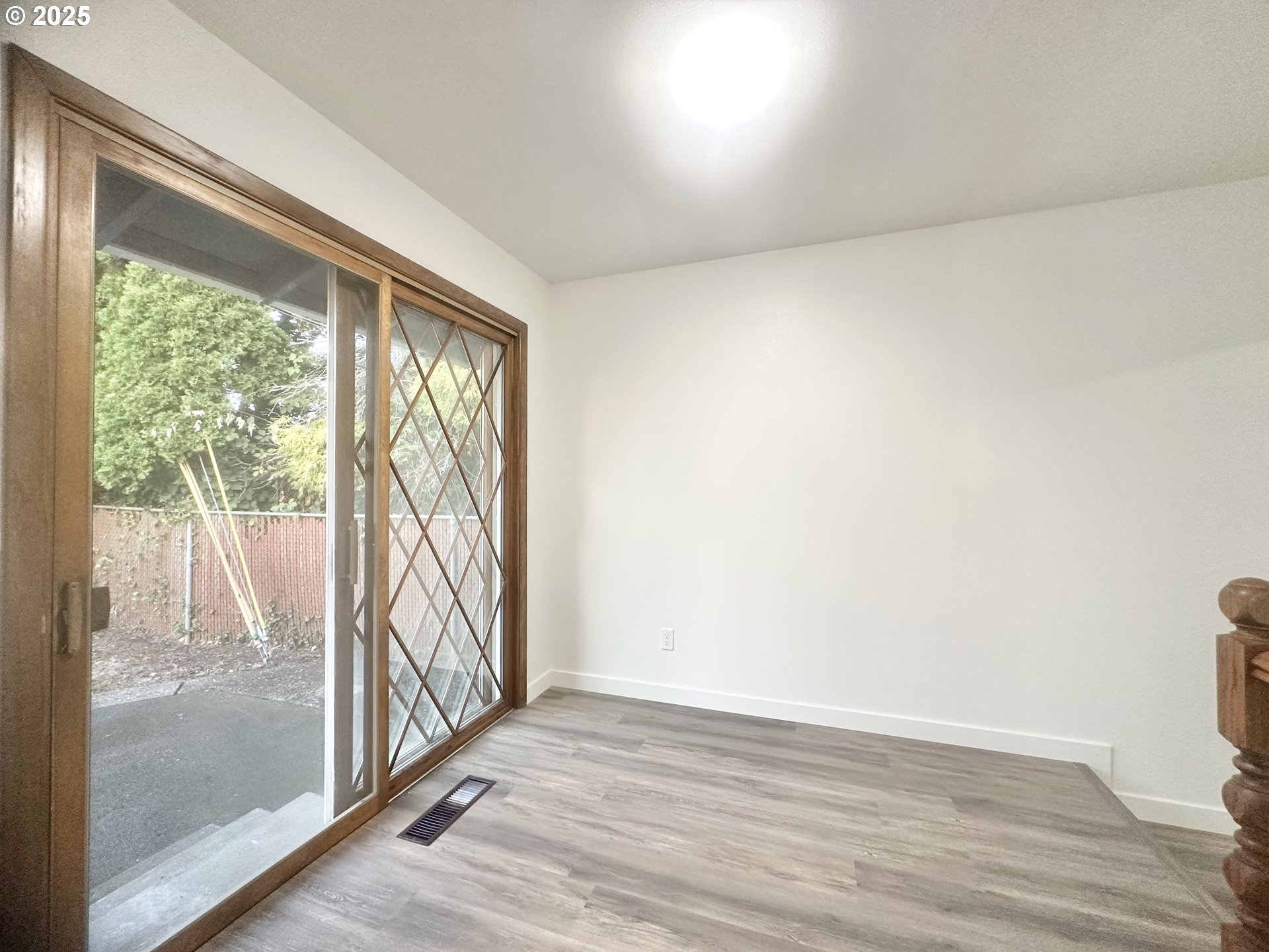 18505 Southeast Clinton Street Gresham, OR 97030 - Photo 12 of 39 a view of an empty room and wooden floor