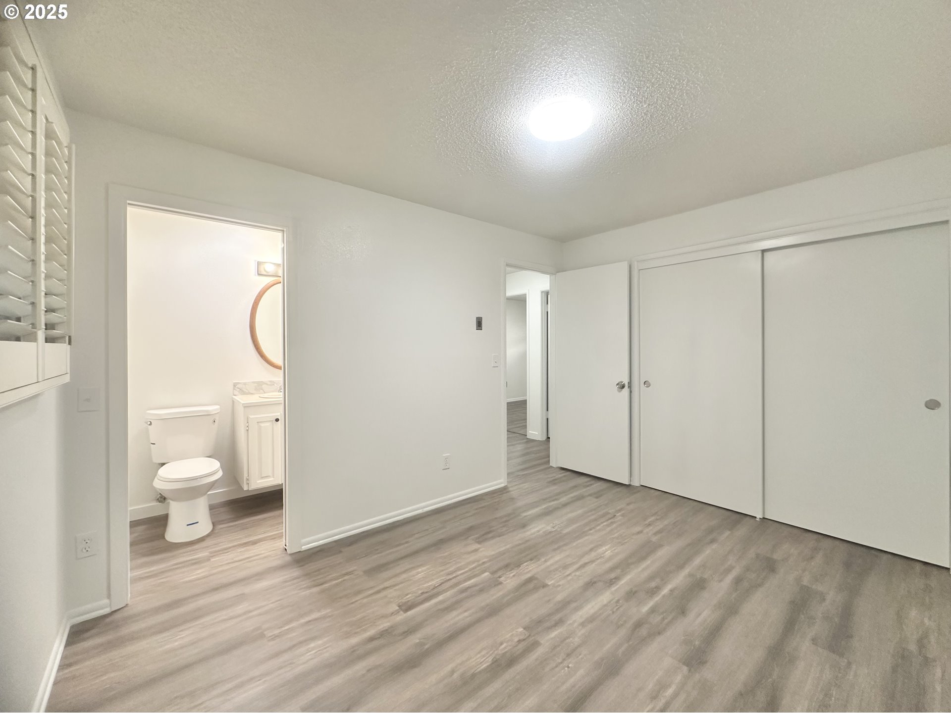 18505 Southeast Clinton Street Gresham, OR 97030 - Photo 14 of 39 a view of a room with wooden floor and toilet