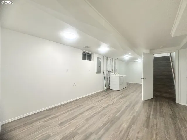 a view of a livingroom with wooden floor