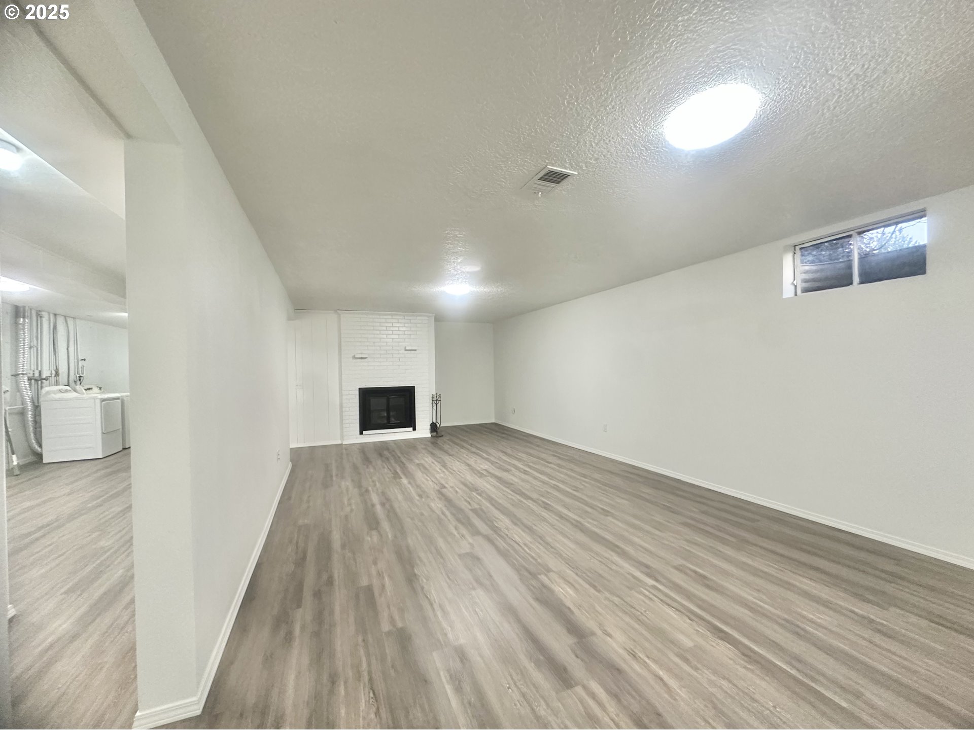 18505 Southeast Clinton Street Gresham, OR 97030 - Photo 27 of 39 a view of empty room with wooden floor