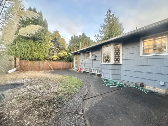 a backyard of a house with lots of green space