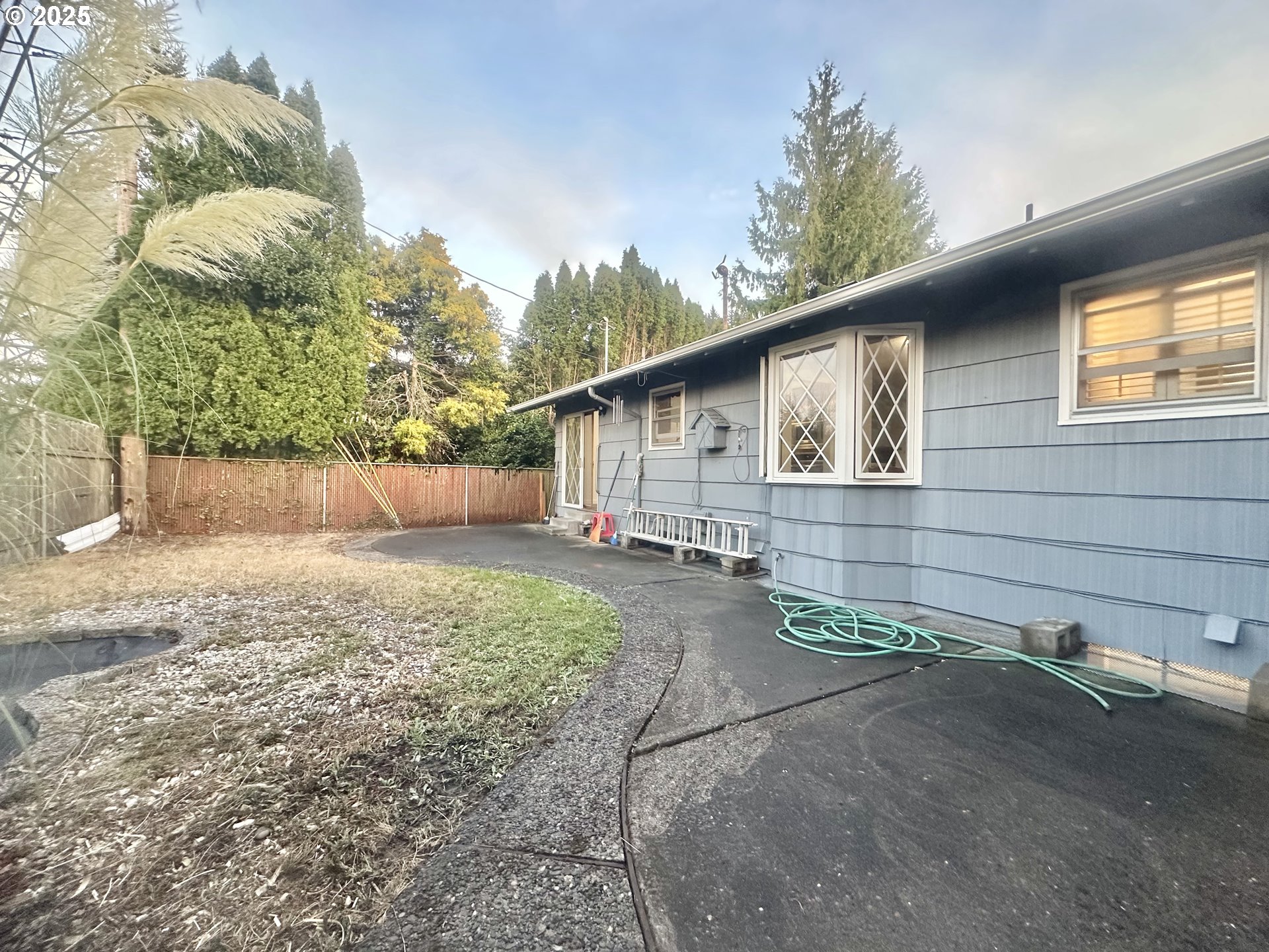 18505 Southeast Clinton Street Gresham, OR 97030 - Photo 35 of 39 a backyard of a house with lots of green space