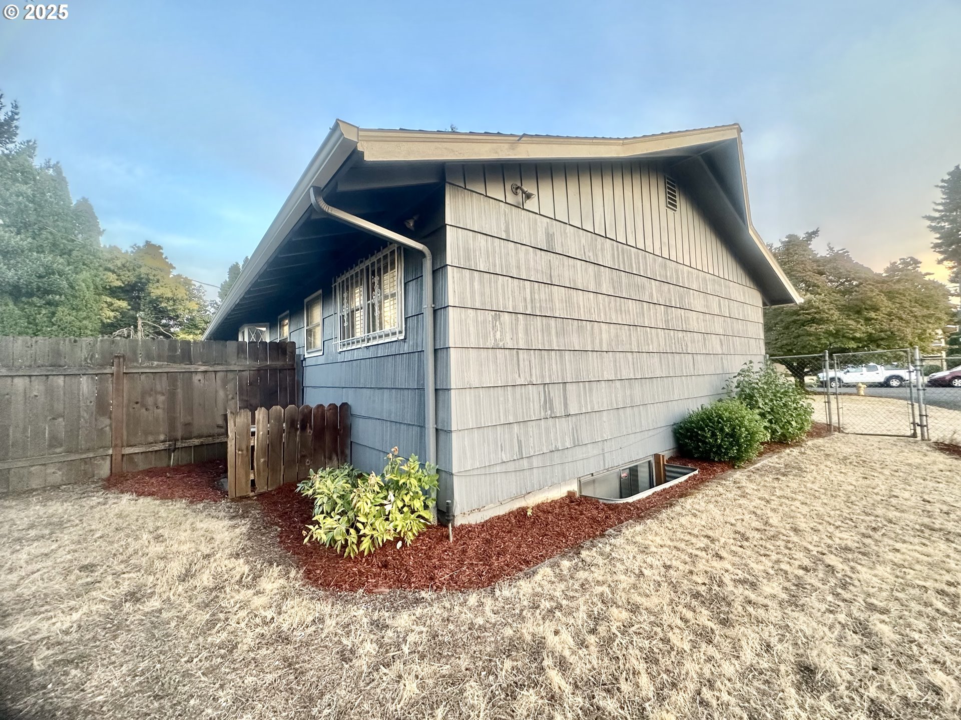 18505 Southeast Clinton Street Gresham, OR 97030 - Photo 38 of 39 a backyard of a house with lots of green space
