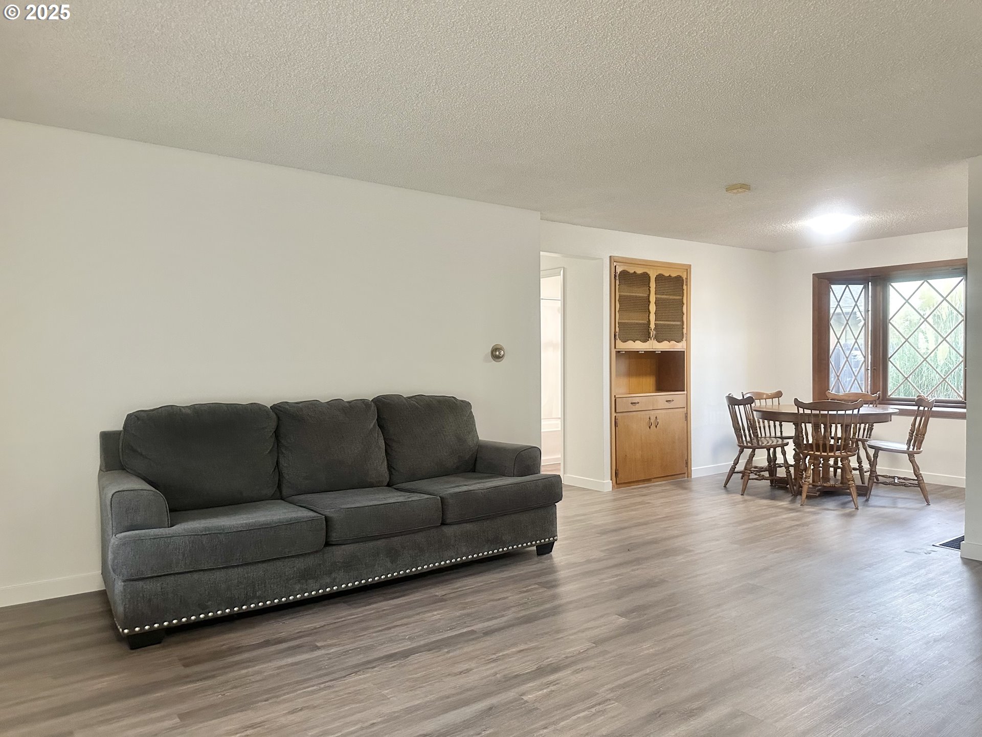 18505 Southeast Clinton Street Gresham, OR 97030 - Photo 5 of 39 a living room with furniture and wooden floor