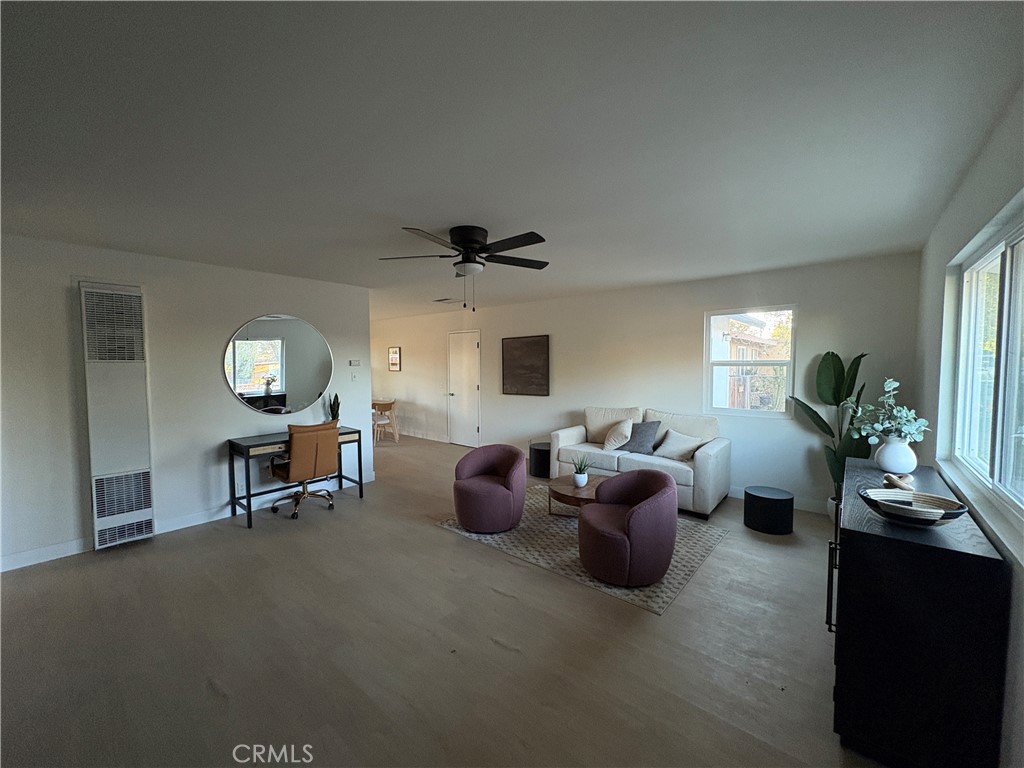 16245 Pine Street Hesperia, CA 92345 - Photo 4 of 5 a living room with furniture and a fireplace