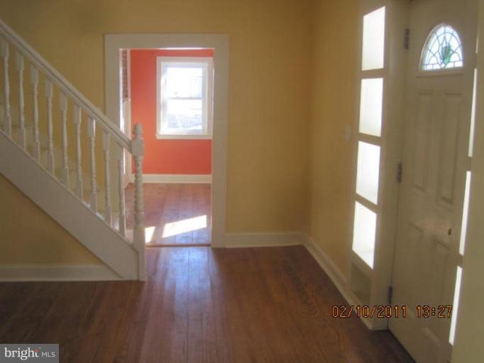 1335 Bruceville Road Keymar, MD 21757 - Photo 7 of 16 a view of empty room with wooden floor and fan