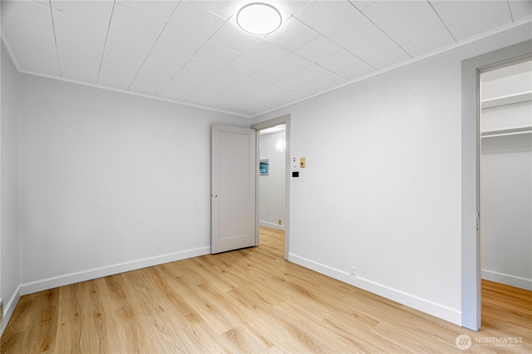 22504 Dorre Don Way Southeast Maple Valley, WA 98038 - Photo 15 of 21 a view of an empty room with wooden floor