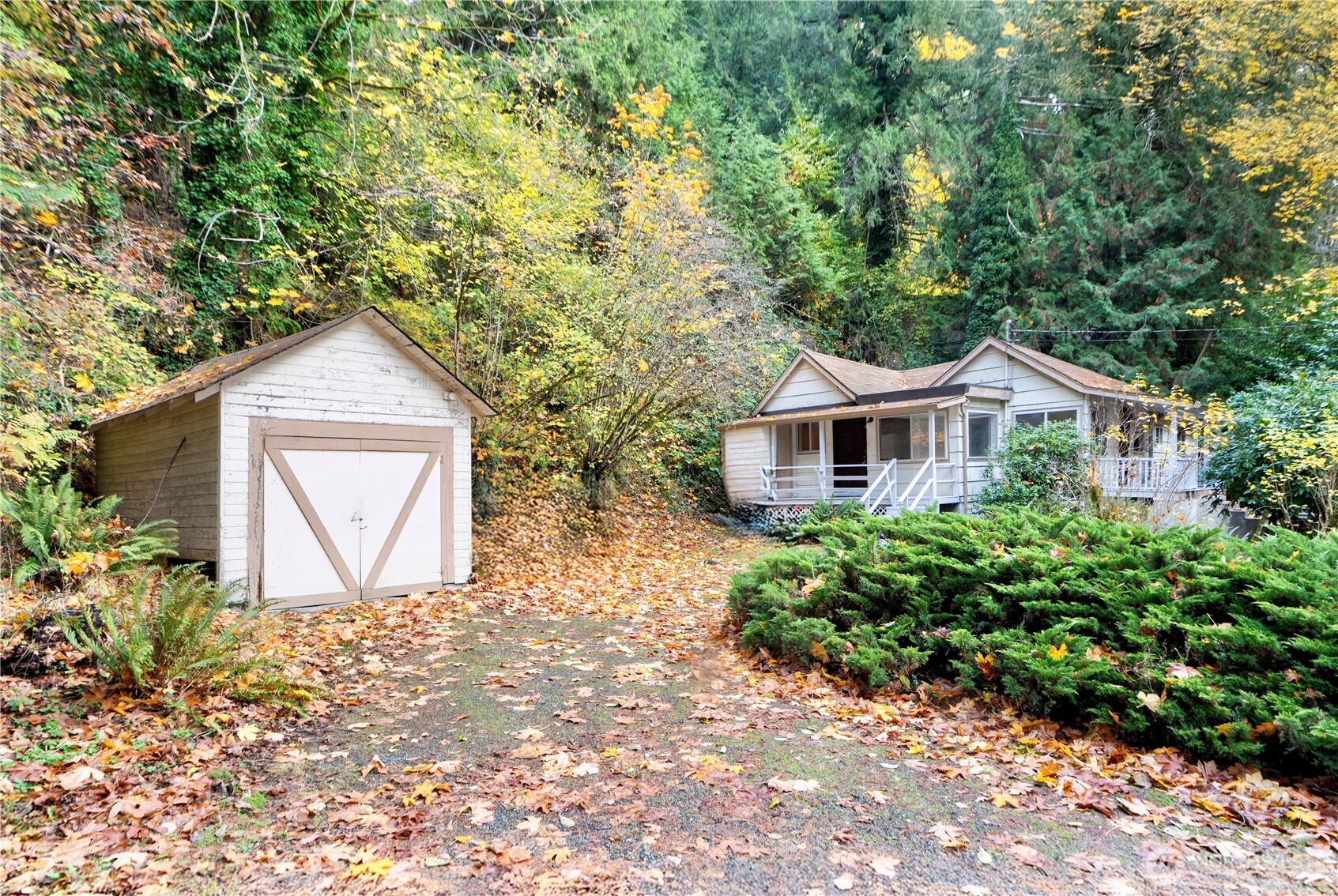 22504 Dorre Don Way Southeast Maple Valley, WA 98038 - Photo 20 of 21 a front view of a house with a yard and garage