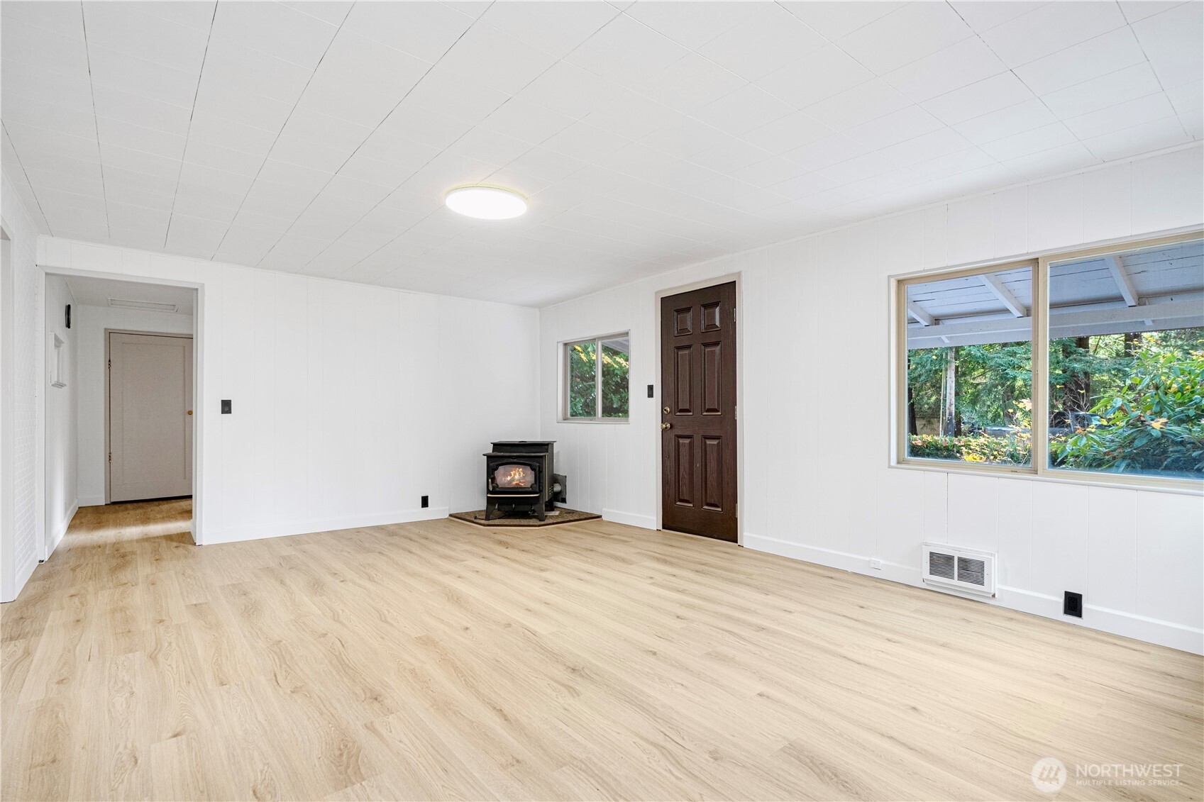22504 Dorre Don Way Southeast Maple Valley, WA 98038 - Photo 8 of 21 a view of an empty room with a window