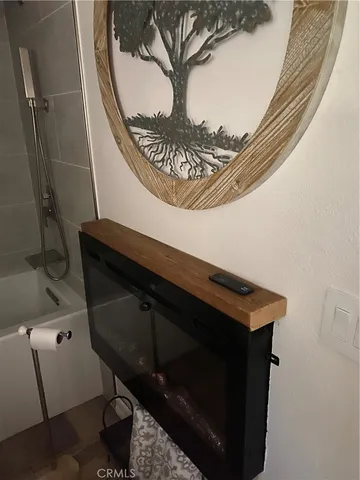 a bathroom with a toilet a sink and a mirror