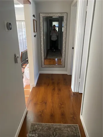 a bedroom with a bed and dresser