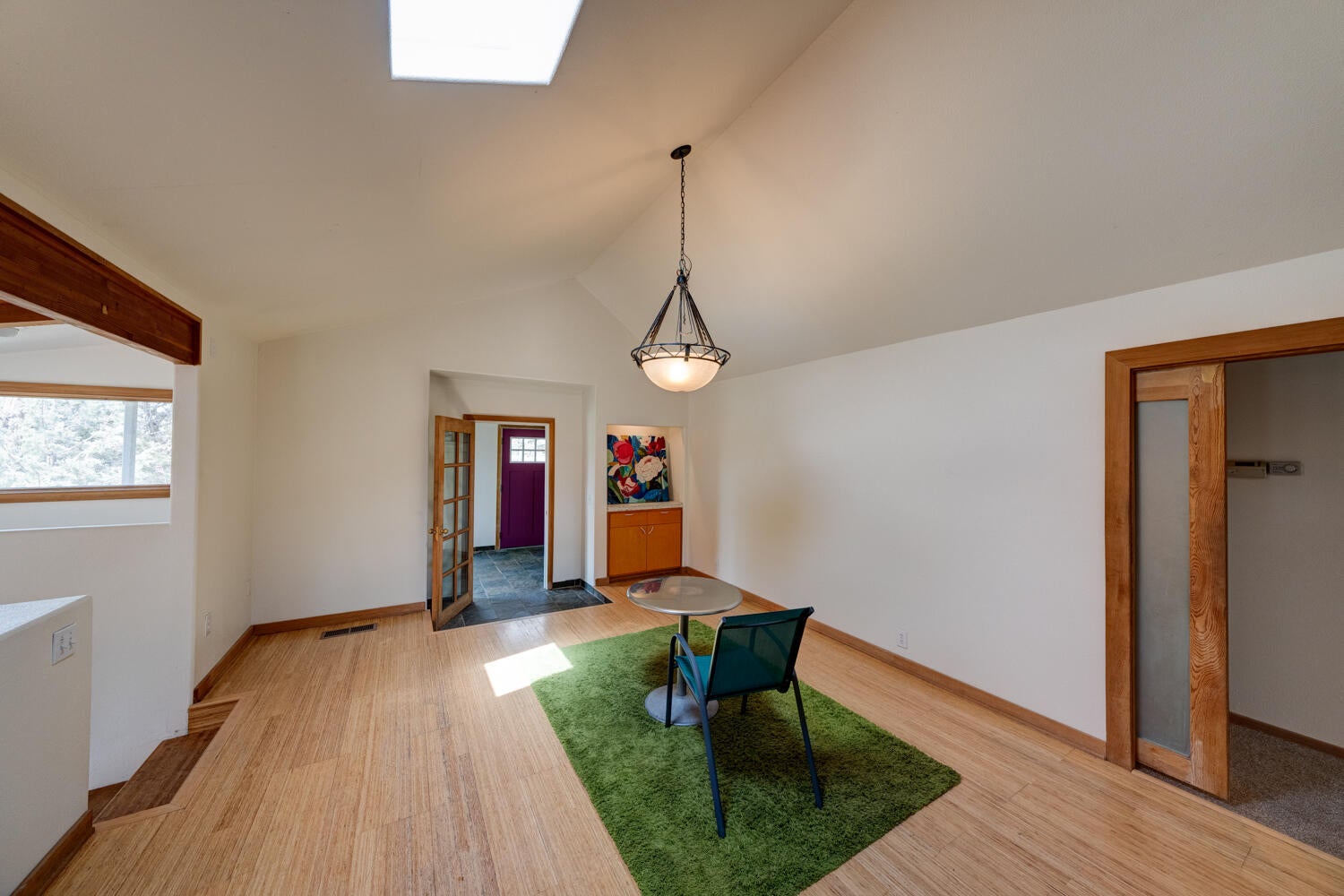 64925 McGrath Road Bend, OR 97701 - Photo 8 of 51 View of entry from living room, hallway to bedrooms on right and stairway to great room on left