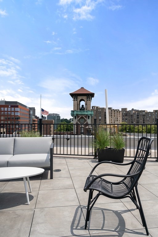 69 Walnut Street, Unit 15 Brookline, MA 02445 - Photo 13 of 21 a view of a chairs and tables in the terrace