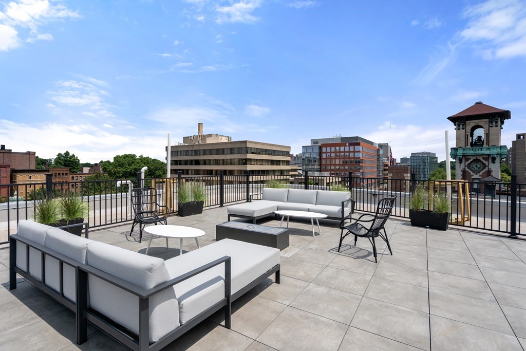69 Walnut Street, Unit 15 Brookline, MA 02445 - Photo 14 of 21 a view of a terrace with couches and a table