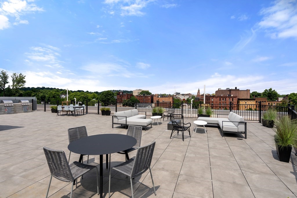 69 Walnut Street, Unit 15 Brookline, MA 02445 - Photo 16 of 21 a view of a terrace with furniture