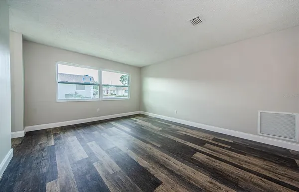 a view of room with hardwood floor